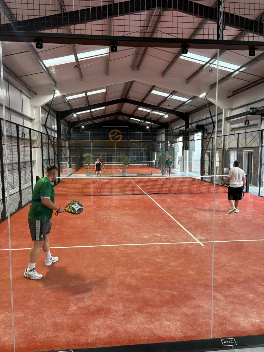 Players mid-match on an indoor padel court at gotpadelclub Lincoln